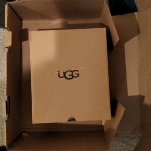 Brand New wrapped, never pulled out of Box size 5 UGG W/mini Baley Bow Glimmer